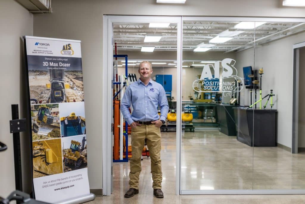 AIS employee in front of the Positioning Solutions center