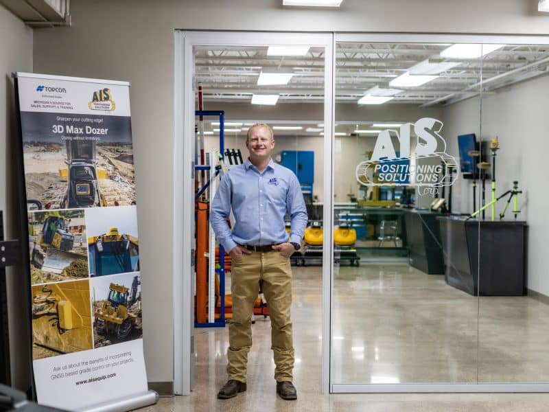 AIS employee in front of the Positioning Solutions center